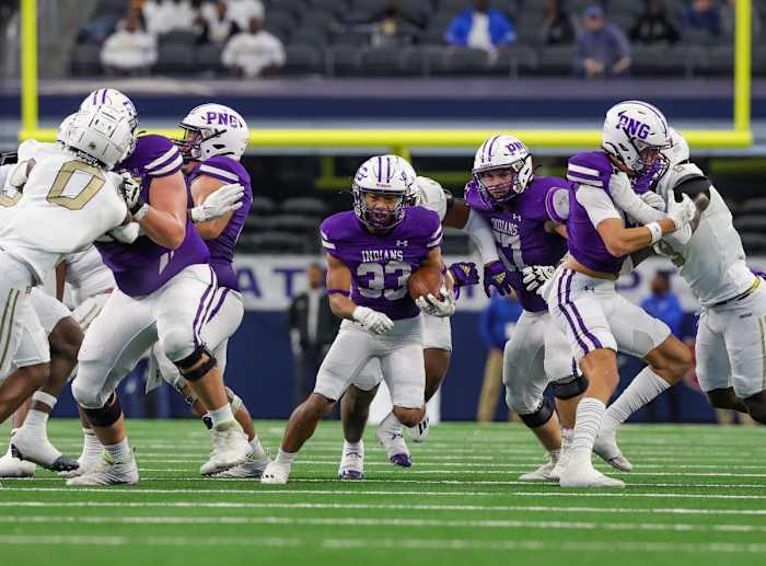 Isaiah Nguyen takes a carry during the first half of the 5A Division II Texas UIL state title on Saturday at AT&T Stadium. The PNG running back